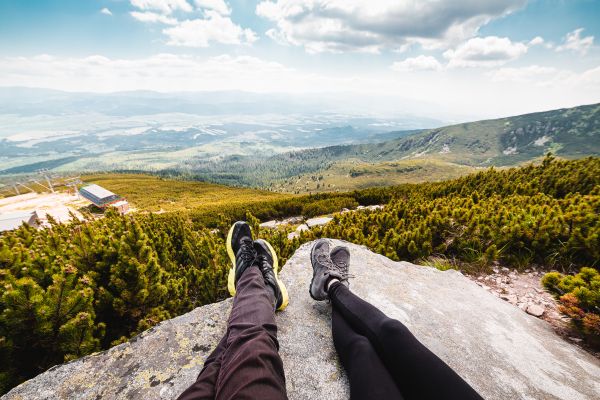 Couple Relaxing After Mountain Hiking Free Stock Photo