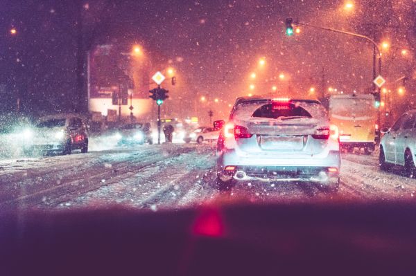 Driving in Evening Traffic Jam and Snow Calamity Weather Free Stock Photo