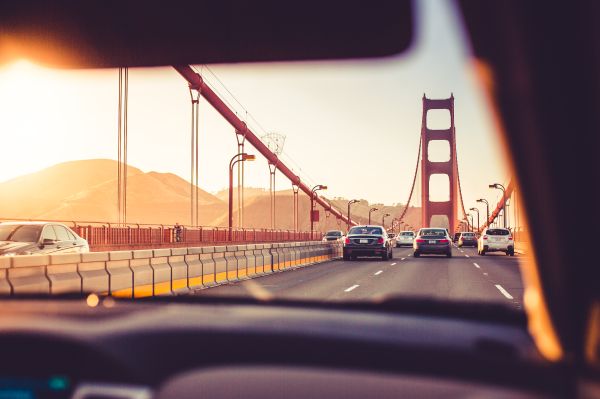 Driving Over The Golden Gate Bridge in Sunset Free Photo