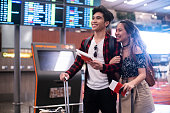 Young Millennial couple at the airport
