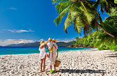 Family with three year old boy on beach. Seychelles, Mahe.