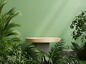 Wooden podium display with leaf shadow composition for product presentation.