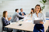 Young business woman with digital tablet in the office