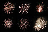 Set with golden festive real firework round shapes on black background for overlay blending mode of yours design project