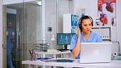 Specialist health practitioner prescribing treatments for patients