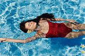 Pretty young female summer blue women lifestyle water vacation holiday person beauty swim pool