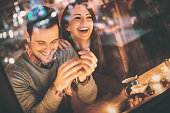 Couple having fun at coffee house.