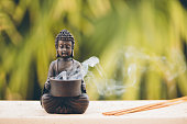 Buddha figurine with incense