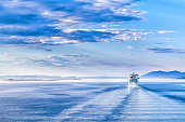 Path on the water from a large cruise ship