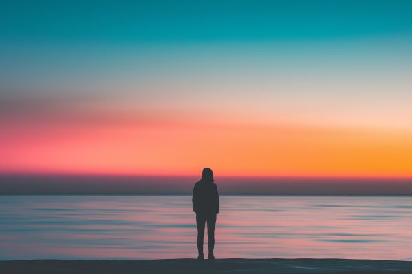 Long Exposure Photo of a Person After Sunset Over the Sea Free Image