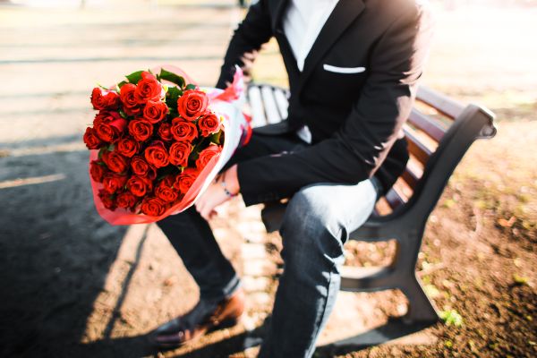 Man with a Bouquet of Roses Free Stock Photo